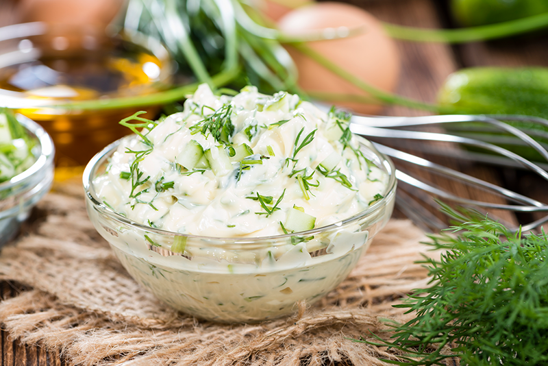 A glass dish of rosemary mayonnaise