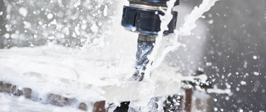 Drill cutting with lubricating fluid