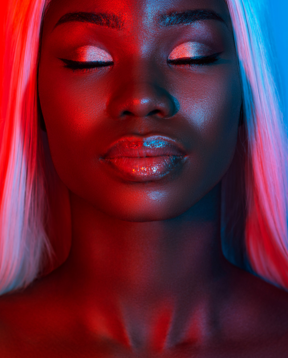 A woman with make up under a red light