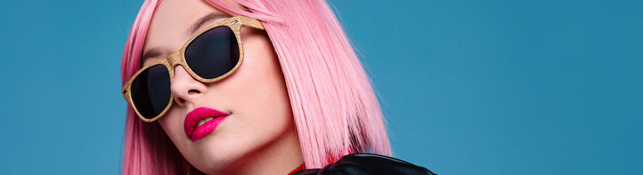 image of trendy woman with pink hair and sunglasses