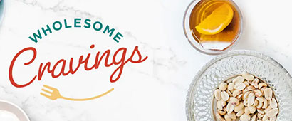 Wholesome Cravings banner with a plate of nuts