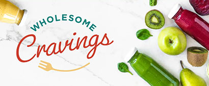 Wholesome Cravings banner with a selection of kiwis, apples, pears and juices