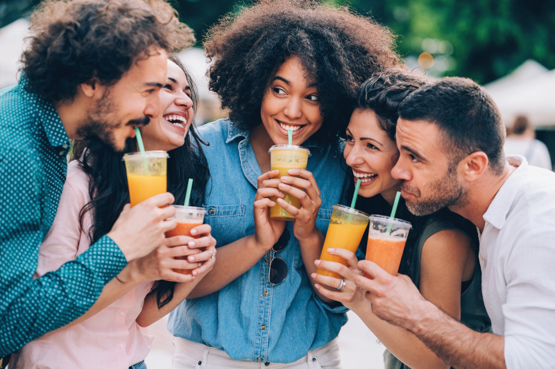 A group of people enjoying a healthy drink