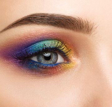 Close up of an eye with colourful makeup