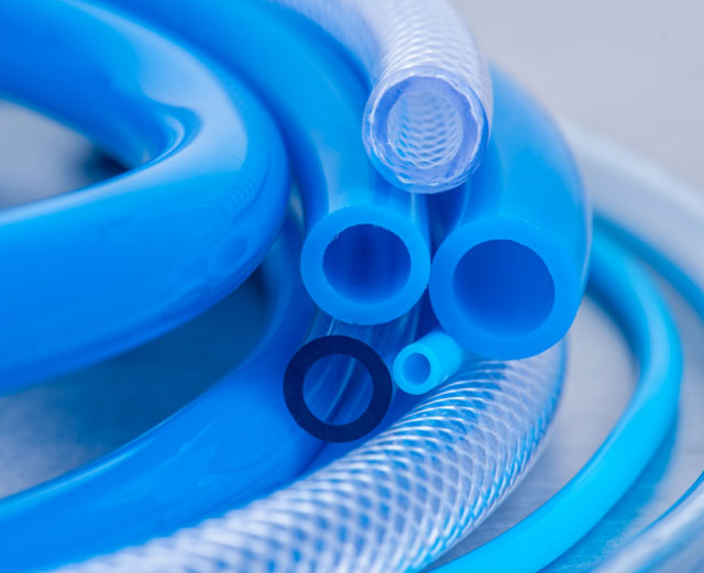 Assortment of blue hoses made from rubber and plastic additives